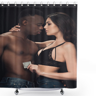 Personality  Sensual Woman Embracing Shirtless African American Man And Holding Condom Isolated On Black Shower Curtains