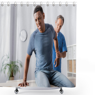 Personality  Injured African American Man Suffering From Pain Near Masseur On Blurred Background Shower Curtains