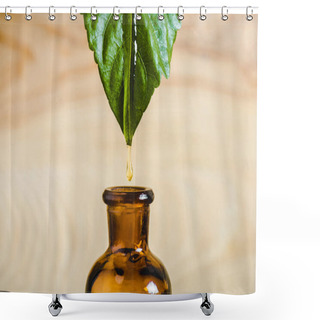 Personality  Close Up Of Essential Oil Dripping From Leaf Into Glass Bottle Isolated On Beige Shower Curtains