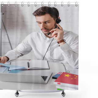Personality  Young Interpreter In Headset Holding Document Near Digital Translator And Dictionaries On Blurred Foreground Shower Curtains