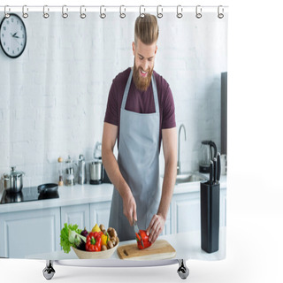 Personality  Handsome Smiling Young Man In Apron Cutting Bell Pepper On Wooden Cutting Board Shower Curtains