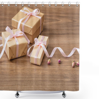 Personality  Presents Concept. Close Up Of Beige Craft Gift Boxes With Pink Silky Ribbon On A Wooden Background, Copy Space. Shower Curtains
