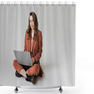 Personality  Charming Young Woman In Golden Necklace Sitting With Crossed Legs In Terracotta And Trendy Suit, Using Laptop While Working Remotely On Grey Background, Freelancer, Digital Nomad  Shower Curtains