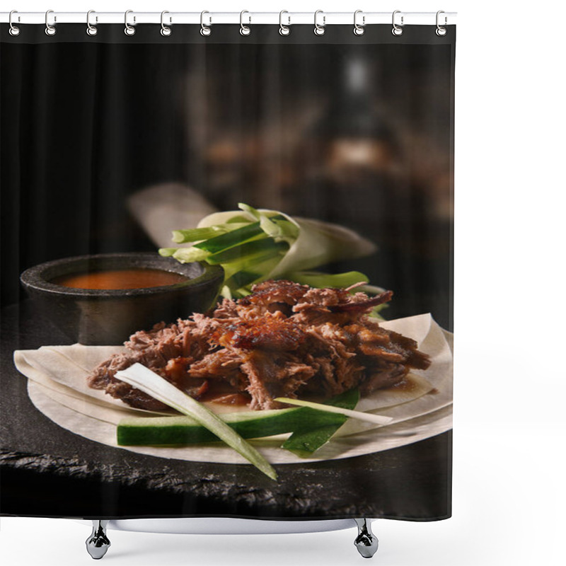 Personality  Creatively lit succulent classic Chinese shredded Peking duck with Hoisin sauce and flour pancakes with sliced scallions and cucumber garnish. Copy space. shower curtains