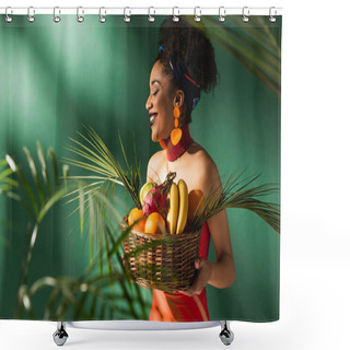 Personality  Smiling Young African American Woman In Red Swimsuit Holding Basket With Exotic Fruits On Green Shower Curtains