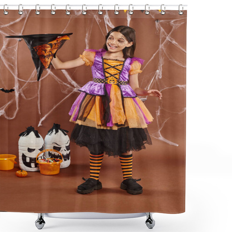 Personality  Cheerful Child In Halloween Witch Costume Holding Pointed Hat Upside Down On Brown Background Shower Curtains