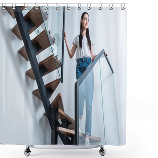 Personality  Low Angle View Of Smiling Woman In Jeans Looking Away While Standing On Stairs At Home Shower Curtains