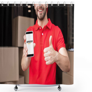 Personality  Partial View Of Cheerful Delivery Man With Smartphone With Amazon Logo On Screen Showing Thumb Up Shower Curtains