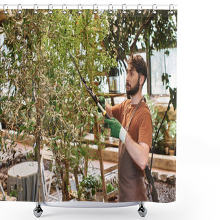 Personality  Handsome Gardener In Linen Apron Cutting Branch On Tree With Big Gardening Scissors In Greenhouse Shower Curtains