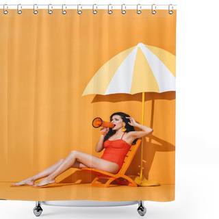Personality  Beautiful Woman In Swimwear Holding Megaphone And Screaming While Sitting On Deck Chair Near Paper Cut Umbrella On Orange Shower Curtains