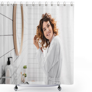 Personality  Smiling Woman With Hands Near Hair Looking At Camera Near Toiletries On Blurred Foreground  Shower Curtains