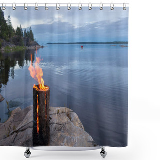 Personality  A Fire From One Log Burns On The Lake Shore In The Evening. Shower Curtains