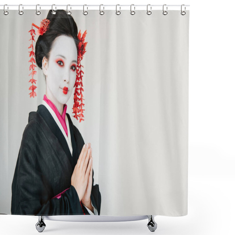 Personality  smiling beautiful geisha in black kimono with greeting hands isolated on white with copy space shower curtains