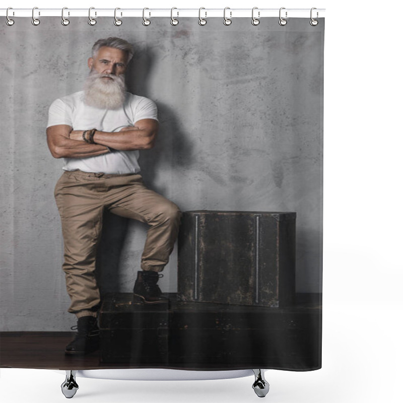 Personality  Stylish and handsome bearded senior man posing in studio shower curtains