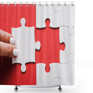 Personality  Cropped Of Woman Touching Jigsaw Near Connected White Puzzle Pieces On Red Shower Curtains
