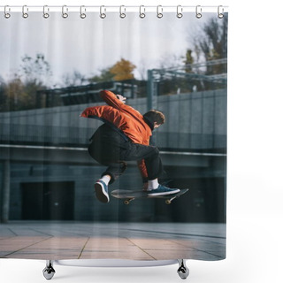 Personality  Skateboarder In Red Jacket Performing Jump Trick In Urban Location Shower Curtains