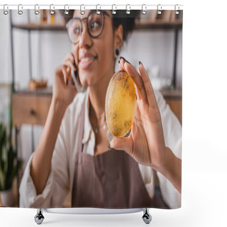Personality  Handmade Soap In Hand Of Pleased African American Craftswoman Accepting Order On Smartphone On Blurred Background Shower Curtains