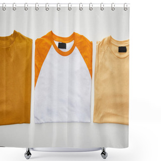 Personality  Top View Of Ochre, Beige And Orange Folded T-shirts On White Background Shower Curtains