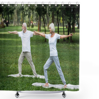 Personality  Senior Couple Standing In Warrior II Poses On Yoga Mats In Park Shower Curtains