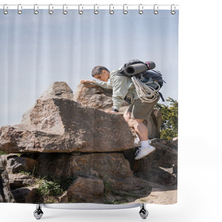 Personality  Side View Of Young Short Haired Female Tourist With Backpack And Travel Equipment Climbing On Stones With Blue Sky And Nature At Background, Exploring New Horizons, Summer Shower Curtains