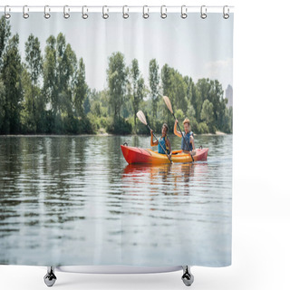 Personality  Active And Happy Multiethnic Couple In Life Vests Holding Paddles While Sailing In Sportive Kayak On Lake With Green Trees On Scenic Shore During Water Recreation In Summer Shower Curtains