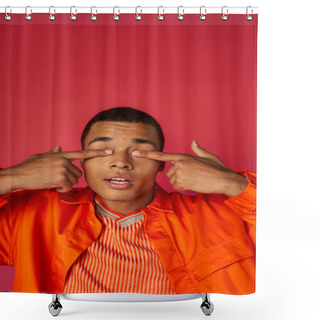 Personality  Positive African American Man In Orange Shirt Obscuring Eyes With Fingers On Red Background Shower Curtains
