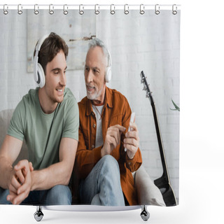 Personality  Grey Haired Man In Wireless Headphones Holding Smartphone Near Smiling Son  Shower Curtains