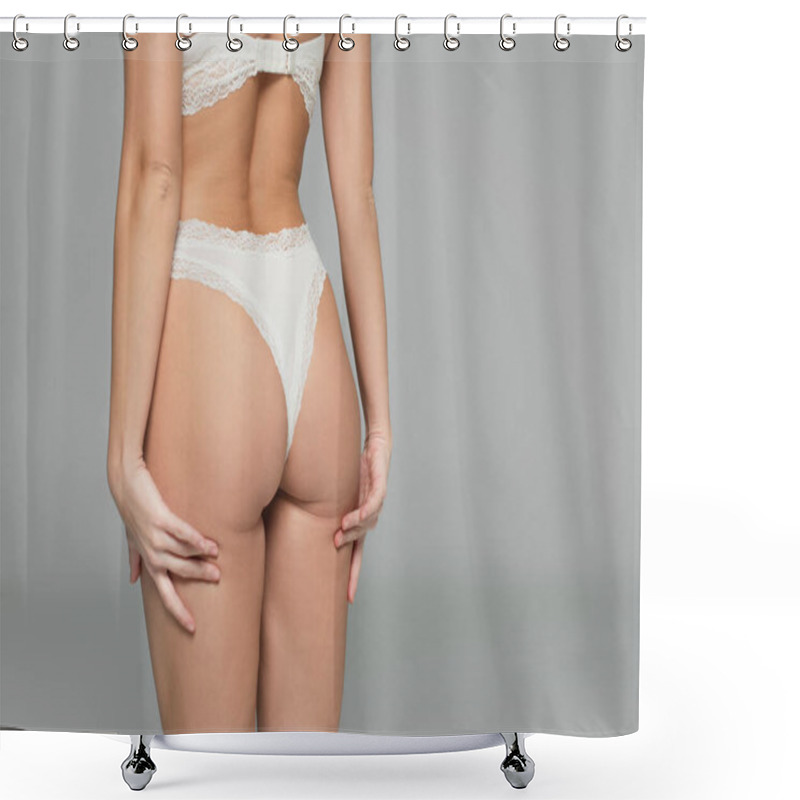 Personality  Cropped view of buttocks of woman in lingerie isolated on grey shower curtains