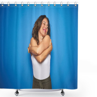 Personality  Middle Age Senior Woman With Curly Hair Standing Over Blue Isolated Background Hugging Oneself Happy And Positive, Smiling Confident. Self Love And Self Care Shower Curtains