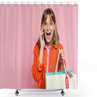 Personality  Shocked Woman Looking At Camera While Holding Purchases With Sale Word On Price Tags And Talking On Smartphone On Pink Background Shower Curtains