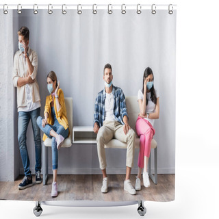 Personality  Skeptical Multiethnic People In Medical Masks Looking Away Near Man On Chair In Queue  Shower Curtains
