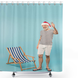 Personality  Pleased Mature Man In Santa Hat Holding Glass Of Champagne Near Deck Chair On Blue Shower Curtains