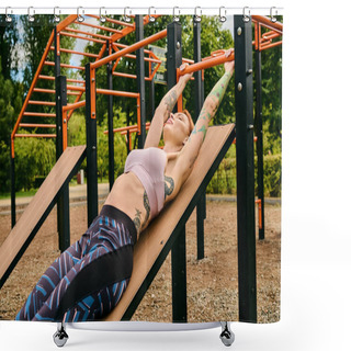 Personality  A Woman In Sportswear Lies Peacefully On A Wooden Bench During A Workout Session Outdoors. Shower Curtains