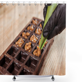 Personality  Cropped View Of Chocolatier In Latex Glove Holding Pastry Bag With Caramelized Nuts Near Chocolate Molds  Shower Curtains