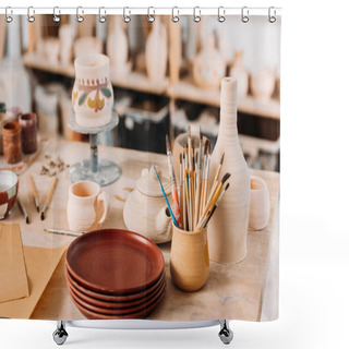 Personality  Ceramic Dishware And Brushes On Wooden Table In Pottery Workshop Shower Curtains