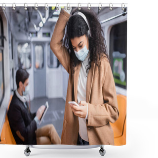 Personality  Young African American Woman In Medical Mask Listening Music And Using Smartphone Near Man In Subway On Blurred Background  Shower Curtains