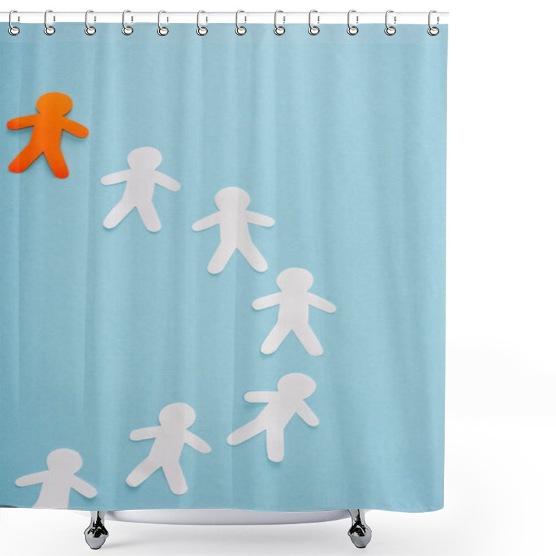 Personality  Top view of unique orange decorative man among white on blue  shower curtains