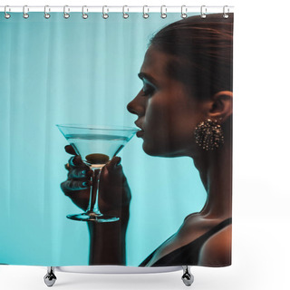 Personality  Side View Of Woman Holding Glass And Drinking Martini Isolated On Blue Shower Curtains