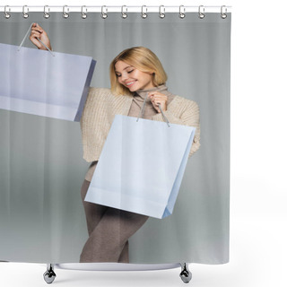 Personality  Pleased Blonde Woman In Turtleneck And Cardigan Holding Shopping Bags On Grey Shower Curtains