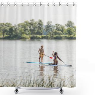 Personality  Redhead And Sportive Man Paddleboarding Along Green Riverside Near African American Woman In Colorful Swimsuit During Summer Recreation On Summer Weekend Shower Curtains