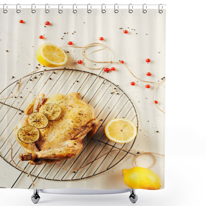 Personality  top view of fried chicken and lemons on metal grille with berries and string shower curtains