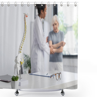 Personality  Medical Model Of Spine Near Interracial Doctor And Patient On Blurred Background  Shower Curtains