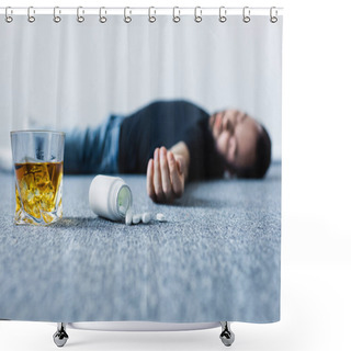 Personality  Selective Focus Of Unconscious Man Lying On Grey Floor Near Glass Of Whiskey And Container With Pills  Shower Curtains