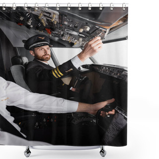Personality  Pilot In Cap And Uniform Reaching Overhead Panel Near Co-pilot Using Yoke In Airplane Simulator Shower Curtains