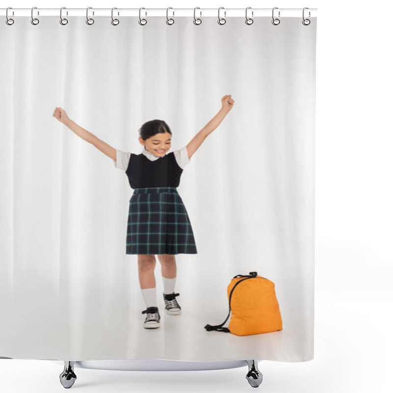 Personality  cheerful girl looking at backpack and standing with outstretched hands, yay, back to school concept shower curtains