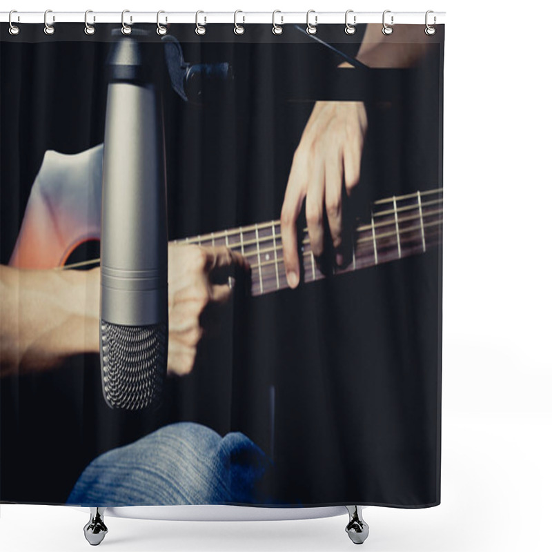 Personality  male musician playing acoustic guitar behind condenser microphone in recording studio shower curtains