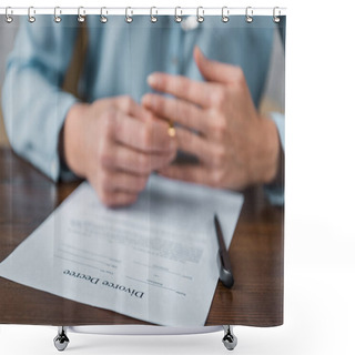 Personality  Close-up View Of Divorce Decree And Woman Taking Off Wedding Ring Behind  Shower Curtains