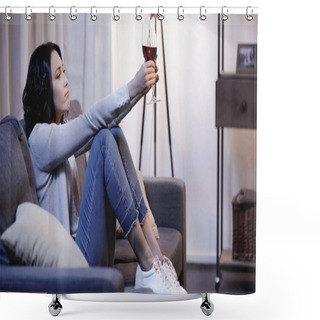 Personality  Depressed Woman In Beige Sweater And Jeans Sitting On Sofa And Holding Glass Of Red Wine In Outstretched Hands At Home Shower Curtains