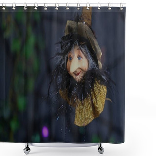 Personality  Halloween Holiday Background. A Figurine Of Flying Aged Witch With Kindness Face On A Dark Blurred Background Of Cobwebs. Concept Of All Hallows Eve. Shower Curtains