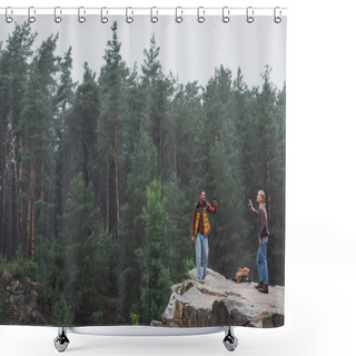 Personality  Happy Couple With Smartphones Standing On Rocky Cliff During Rain Shower Curtains